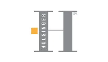 A gray and white logo of the holsinger group.